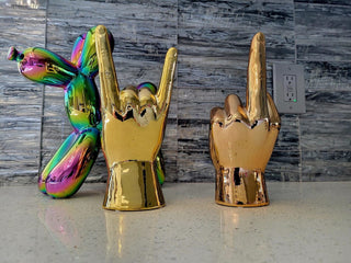 Interior Illusions middle finger hand sculpture bronze
